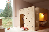 The combination bunk bed and playhouse is another whimsical gesture the architect designed specifically for her two daughters. The spaces are organized in such a way that they can play independently or together.