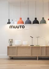 The space marries usability with refined presentation. Here, an assortment of Mhy, Unfold, and E27 pendant lamps (left to right) hang above Cosy lamps by Harri Koskinen (left) and Leaf lamps by Broberg & Ridderstråle (right).  Photo 4 of 7 in Muuto's Sophisticated Copenhagen Office is All About Transparency