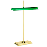 A modern take on an old classic, the Goldman Table Lamp is a high-powered desk lamp with a minimal footprint. The lamp is available with a gold base and transparent diffuser, reminiscent of traditional banker’s lamps, or in a more refined black and grey design. The lamp is illuminated by an optical switch on its base and uses soft touch dimming technology so it’s easy to adjust between decorative accent light and pronounced workspace lighting.