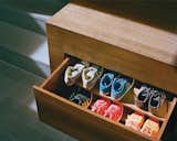 Generous storage is key to an uncluttered look. Drawers for shoes tuck away under the raised mezzanine floor.