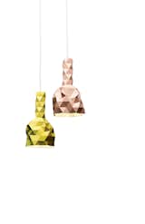 Faceture lamps by Phil Cuttance. Though the facets of the New Zealand designer’s pendant lights suggest machine tooling, each unique and handmade object is produced by casting a water-based resin into a mold.  Search “resin-champagne-bucket.html” from Home Trend: Pastel Furniture and Accessories