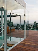 Outdoor, Large Patio, Porch, Deck, and Rooftop Architect Don Dimster integrated a new roof deck and custom furnishings into Chris and Marjorie Rice’s 1960s Buff, Straub and Hensman home in Los Angeles.  Search “data-modern-furnishings.html” from A Midcentury Home Enjoys Views from Every Angle
