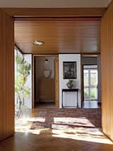 Hallway and Medium Hardwood Floor Ballantyne House by Warren & Mahoney (1959)  Photos from Decades Old, the Modernist Houses of New Zealand Have No Shortage of Charm