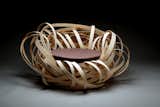 Inspired by bird nests, artist Nina Bruun used curled strips of birch to mimick the organized chaos of a bird’s home in her Nest chair. Birch, textile, foam, 2010. Courtesy of the artist, photo by Adam Dyrvig Tatt.