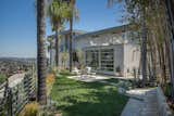 2,200 square feet of outdoor space wraps the home, and nearly every room is accessibly by terrace.  Photo 7 of 10 in Bright Stucco Homes by Luke Hopping