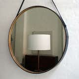 CAPTAIN’S MIRROR

There is no denying the style and quality of this distressed leather framed mirror lined with wood and a cast bronze hanging pull.