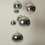 MIRROR BALL PENDANT

Blown like bubble gum into a mould, these plastic spheres are metalized internally to give a mirrored finish. This internal metallic design focuses the brightness from the lamp, projecting a soft, broad beam of light.