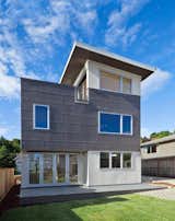 The couple desired a new home that would suit their eco-conscious lifestyle. On their must-have list was a location close to Seattle’s recreational-friendly Greenlake, a large roof deck, eco-friendly materials that reduced their carbon footprint, and surprisingly, no garage. “It is a modular home, so basically you're saving a lot of money on the [construction] time," says the team behind Greenfab, which served as general contractor for the project. "Your construction costs are also way lower.”