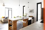 The house has an open-plan kitchen and living/dining area.  Photo 4 of 6 in A Modern House on a Budget in Los Angeles