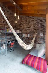 The kids' room features a playful hammock.