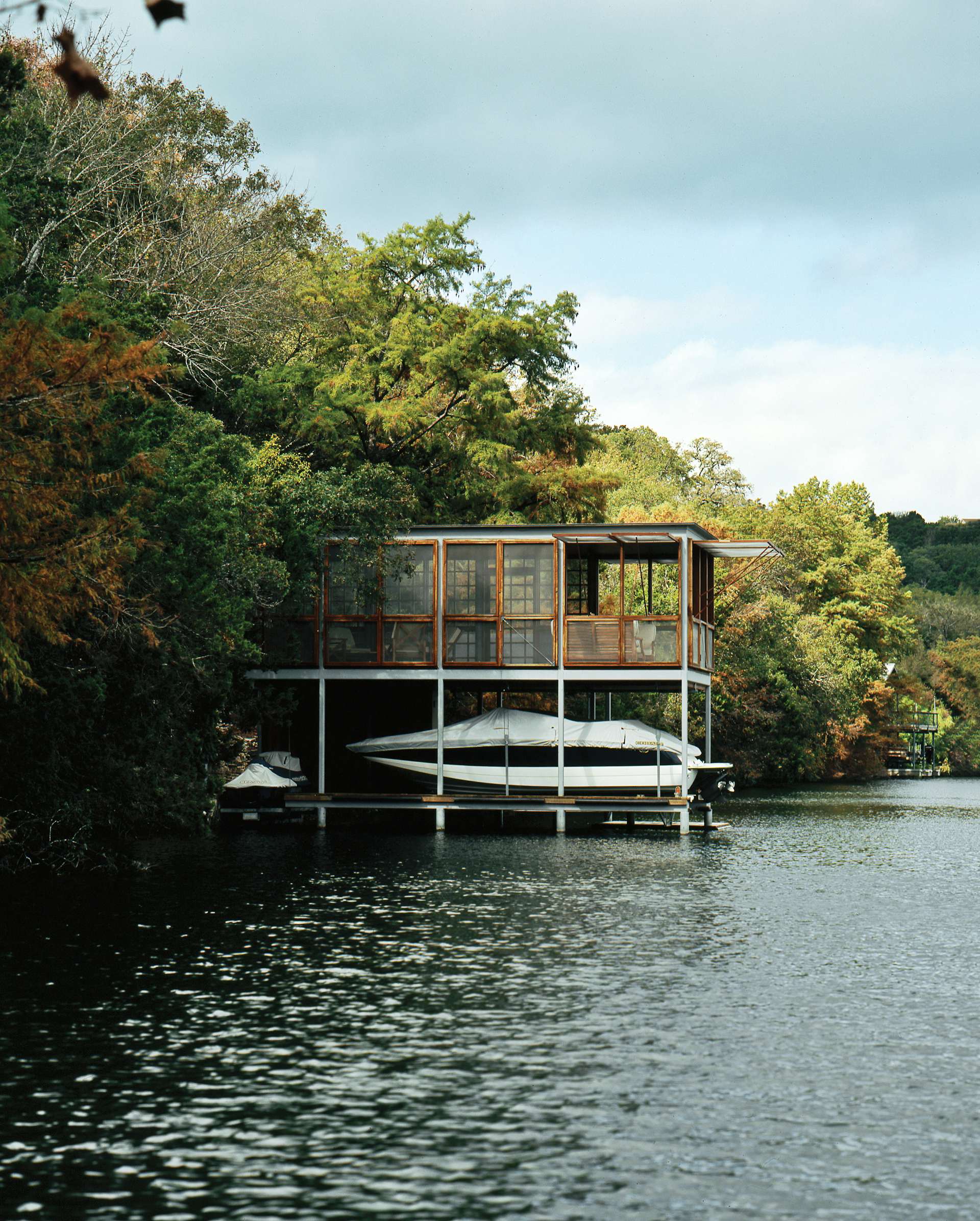 Architecture and design firm Andersson-Wise designed this prefab steel-grid boathouse. The orthogonal frame was delivered from Houston by truck, then transported by barge to the home's final site in Austin, Texas.