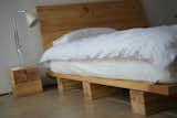 A bed made from local cottonwood, supported by simple platforms.