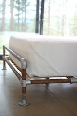 Hirsh and Volny created a bed frame out of a rusted well pipe and scaffolding fittings.  Search “industrial” from Unique Takes on the Modern Bedroom 