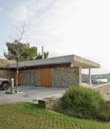 In an effort to root the home to its location, the team elected to use dry-stacked slate quarried from a nearby island for much of the main structure. “These walls are common in the Pelion area of Greece,” says Achilleas.