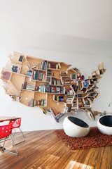 When Russian-born architect Andrei Saltykov designed his home in the UK, he put his love of the USA on the shelf. Showing off his library wasn’t Saltykov’s only aesthetic aim, though. Within the map he fastened 600 tiny Christmas tree lights that represent the nation’s major cities. See more about the USA-shaped shelf here. Photo by Will Pryce.