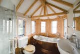 Custom designs, however, are the opposite of roughing it. Pictured, an interior of the Fox and Hounds countryside hotel in Devon, a project built around a 250-year-old oak that includes a tower and turrets.