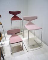 Arper's new upholstered stools in pink, and their tinier cousins, a matching child's chair.