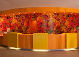 A bright reception desk greets visitors and lets them know they’re on vacation! Photo by: Tim Street-Porter.