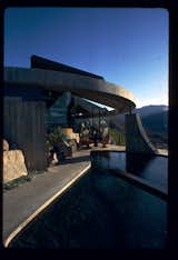 A Dwell Houses we Love story from 2011 took a closer look at the famed Elrod House, also designed by John Lautner. Lautner transformed his early experience working under Frank Lloyd Wright into a career creating a wealth of Southern California structures that broke out of the mold of the oft-restrained geometry of glass and steel. Interior designer Arthur Elrod commissioned this house in 1968, and the cliffside residence—complete with oversize exposed rocks, spiral staircase, and its signature dome—remains one of the most recognizable homes of the era. Photo by John Lautner.