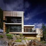 The home's Canadian cedar cladding and aluminium joinery is low-maintenance, and designed to weather gently over time. The natural finish blends well with the surrounding garden, with its sculptural, desert plants. “We face south-west, so the weather comes straight at us, and the wind is loaded with salt,” says Hughes. “Fortunately, the plants we liked don’t give a hoot about the wind.”