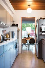 The kitchen in the couple's home retains its original cabinetry.