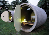 Das Park Hotel in Ottensheim, Austria has made hotel rooms out of retired concrete drainage pipes. After receiving a coat of varnish, a skylight, and a colorful paint job on the back wall, these pipes are ready for occupants.
