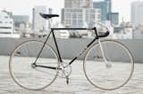 Track Bike by Kinfolk—Desiring a bike built around 80s Japanese track parts, Bartek Kolacz and Kinfolk Studios created this beautiful track number with a hand-crafted frame by master builder Shiuchi Kusaka in Kansai, Japan. Frames are emblazoned with the ethos 'Run With The Hunted,' cockpit and seat mast all Nitto, and the cherry on the top—a Kashimax Aero saddle. Photo by: Bartek Kolacz  Photo 2 of 6 in Modern Bikes by Eujin Rhee
