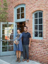 Keiko and Taku Shinomoto (with Fido—pronounced FEE-do) stand outside Tortoise, which is set off by a small outdoor courtyard.
