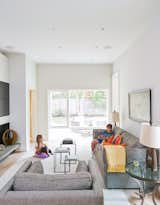 Living Room, Chair, Sofa, Ceiling Lighting, and Recessed Lighting To create privacy, the residents opted to keep the family room separate from the other living spaces. The sofa, chair, and rug are from Room & Board.  Photos from An Impressive 20-Foot Skylight Transforms a Jumbled Chicago Home