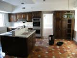 The pre-renovation kitchen.  Photo 6 of 13 in An Impressive 20-Foot Skylight Transforms a Jumbled Chicago Home