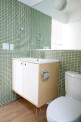 In the bathrooms, Sweet used a mirror to enlarge the feel of the space. They kept the costs minimal by using Grohe bath fixtures and an Ikea sink.

Don't miss a word of Dwell! Download our  FREE app from iTunes, friend us on Facebook, or follow us on Twitter!