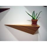 What makes the Angle Shelf unique isn't necessarily what you choose to display on top, but instead what lies beneath: a geometric 3D form, sleek, structural and stuck to the wall. The bamboo unit is finished with 100% natural Tung oil, made in the USA, and available pointing either left or right.