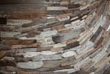 A closeup of the driftwood mosaic that covers a portion of the kitchen counter.

Photo by Barret Gentz.