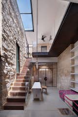 Irit and Zohar imagined a space that would be a cohesive blend of old and new. Stone, metal, glass, and wood intersect in the interior courtyard. Large skylights bring light in, and play upon the indoor-outdoor functionality of the courtyard space.