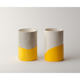Either as a companion to her new tea kettle or as a stand alone gift, we love these hand-crafted earthenware cups by Chicago-based Susan Dwyer. They've been individually dipped in yellow rubber, giving them a bit of grip and a burst of bright color.