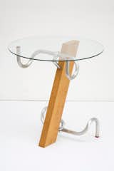 Early in Jasper Morrison's career, he built a table of beech wood, glass, and two bicycle racing bar handles to give the piece a "mass-produced quality" without benefit of a manufacturer. In 1983, the materials for one table cost about £20.00, and he sold them for five times that. "The somewhat eclectic shape of the table itself was fitting to the mood of the time and my own frame of mind, a kind of poetic, anti-establishment, business-like attitude," Morrison is reported as saying years later.