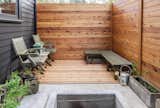 The gap between the house and the fence creates a small patio with space for raised bed vegetable gardening.