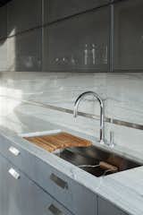A Kallista sink and faucet abuts the back wall.&nbsp;&nbsp;