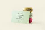 A design and production service provider to the food industry, Helsinki Food Company's pastel colored business card leans against a trio of macaroons.