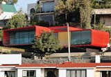 One of Rojkind’s first commissions, in 2001, was a rooftop apartment for a ballerina above her father’s 1960s-era house in the Mexico City suburb of Tecamachalco. Dissatisfied with the look of the Cor-Ten steel exterior, Rojkind hired auto-body workers to finish it with a coat of red automotive paint.