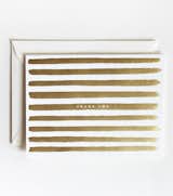 Stripes become festive with gold metallic foil on soft white cardstock on these U.S. made cards from Rifle Paper Co. $18 for a set of 8