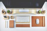 The monitor stands, keyboard trays, and mini planters are meant to keep the average desk from looking too much like a museum exhibition on Scandinavian design.