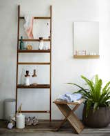 The Nomad Shelf System from Skagerak is part of an innovative storage system that has a thin, space-saving profile. Designed to resemble a ladder, the Nomad rests on the wall, keeping a small footprint. The ladder comes with four hooks, which make it easy to hang small accessories, and the rungs of the ladder can be draped with towels. The Nomad Ladder can be used with the Nomad shelf to create more surface area for storing other items.