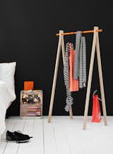 Sturdy but unobtrusive garment racks are a clever option for apartments with little closet space. Nomess Copenhagen's Dress-Up comes in white or black legs with the option of a black, white, or orange hanging bar at top. (Buy it for €229 here.)
