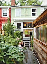 Architect Lyle Bradley spent years of weekends and evenings rehabbing an ailing row house in Boston, coaxing it into a smart home for his young family, complete with raised vegetable gardens, green roofs, and a series of wending pathways in the backyard.