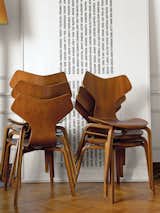 Living Room and Chair A stack of 1955 Grand Prix chairs by Arne Jacobsen rests besides a minimal art piece.  Photo 6 of 18 in A Neoclassical Gallery Home in Belgium