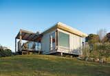 A compact prefab vacation home in the seaside community of Onemana Beach is clad in plywood and vertical timber battens finished in Resene’s Lumbersider Foam paint.  Photo 1 of 6 in Plywood-Loving Prefabs by Andrea Smith