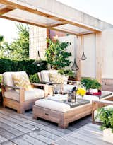 Lacking in outdoor space, Toronto realtor Kara Reed’s condo was in need of a revamp. To give her a place to entertain, Terry Ryan of Cubic Yard Design helped turn her roof into a working backyard of her own—complete with an outdoor kitchen. Contemporary-rustic furniture, accents serving as pops of color, wood, and plenty of sprawling greenery make this rooftop a place of refuge. Photo via Style At Home.