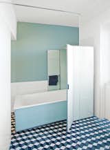 For the bathroom, Reckendorfer wanted a shower for daily use, but opted to keep a 1950s bathtub that she discovered in her basement. "I studied graphic design and photography, so visual things are so important to me," she says. "I love sleek, light-filled Scandinavian designs, but I also love flea markets and pieces with history."
