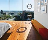 Bedroom, Bed, and Medium Hardwood Floor The LC4 lounge is by Le Corbusier, Charlotte Perriand, and Pierre Jeanneret for Cassina. Operable porthole windows on the east facade offer ventilation.  Photo 11 of 17 in Striking Slatted Wood and Glass Home in San Francisco